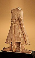 Statue of Kushan emperor Kanishka, 2nd century CE, from Mat near Mathura, wearing Achkan, sash and outer coat.[11]