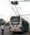 Image 121On this articulated Beijing trolleybus, the operator uses ropes to guide the trolley poles to contact the overhead wires. (from Trolleybus)
