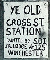 A hand-painted sign reading "Ye Old Cross St. Station Painted by S.O.I. Jr. Lodge #125 Winchester"