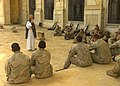 A Catholic chaplain offers Mass with American Marines and Sailors in Tikrit, Iraq.