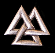 A metallic Valknut in the shape of a trefoil