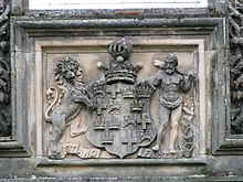 A carving of a coat of arms, showing the arms of the Earl of Seafield