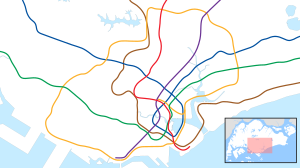 A map of the Singapore rail systems, with a color for each line, and a red dot highlighting the location of Dhoby Ghaut station in central Singapore.