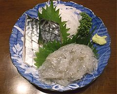 Shimesaba (cured mackerel) and whitebait sashimi with green shiso leaves
