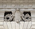 Coat of arms and initials of Midland Bank in the 1930s, above its side entrance on Princes Street, London