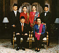 Image 67Formal family portrait of former Indonesian's President B.J. Habibie. Women wear kain batik and kebaya with selendang (sash), while men wear jas and dasi (western suit with tie) with peci cap. (from Culture of Indonesia)