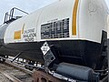 Image 54Trains carrying hazardous materials display information identifying their cargo and hazards. This tank car carrying chlorine displays, among other markings, a U.S. DOT placard showing a UN number that identifies the hazardous substance. (from Train)