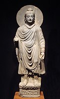 The Buddha wearing kāṣāya robes, c. 200 BC.
