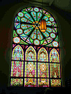Large stained glass window with rose window