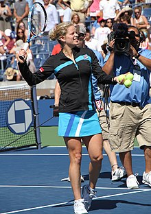 Clijsters preparing to hit souvenir tennis balls into the crowd after her first round match win
