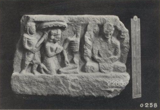 Relief with monk meditating at the right, and on the left, half of a skeleton, a kneeling crowned figure and a second figure holding a parasol above the crowned figure