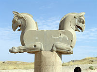 Griffin capital at Persepolis. The roof timbers presumably filled the flat side surface.