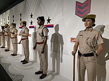 Mannequins in khaki uniforms