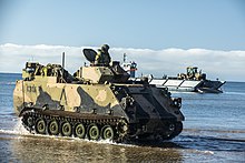 Colour photo of a tracked military vehicle in the water