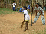 K-25 (Backyard Cricket) Cricket is the most popular game with India's masses.
