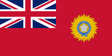 A British blue Ensign (a blue flag with the Union Jack placed at the top left corner) charged with the Star of India (five pointed star inside a circular band tied at the bottom)