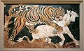 Mosaico di tigre che assale un vitello.