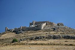 Photograph of a ruined fortress on a hilltop