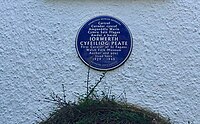 Blue plaque in Rhiwbina Garden Village commemorating Iorwerth Peate, first director of St Fagans National Museum of History