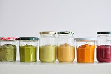 row of colorful purees in mismatched glass jars