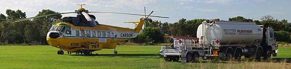 Refueling a fire fighting helicopter Southern River, Western Australia.
