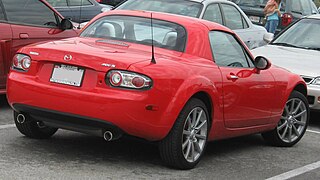 Mazda Miata Power Retractable Hard Top (PRHT) c. 2007, with 77 lb (35 kg) polycarbonate hardtop and identical cargo capacity to the soft top version[24]