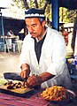 Image 22A man makes plov, the national dish of Tajikistan. (from Culture of Tajikistan)