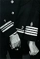 Insignia for Christian, Muslim, and Jewish chaplains on three US Navy chaplains' uniforms