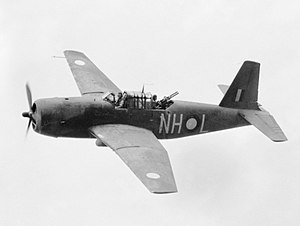 Black and white photo of a single-engined military monoplane in flight