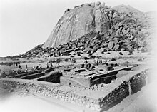 A black and white photograph of an archaeological excavation site