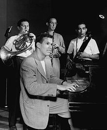 Lawrence at the piano with three band members, 1946