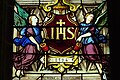 Bókstavirnir IHS eru fyrstu bókstavirnir í orðunum "Jesus Homnium Salvator", t.e. Jesus, menniskjunnar frelsari.