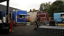 Photograph of food carts and outdoor seating