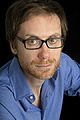 Image 7 Stephen Merchant Photo: Carolyn Djanogly Stephen Merchant (b. 1974) is an English writer, director, radio presenter, comedian, and actor. He is best known for his collaborations with Ricky Gervais, with whom he co-wrote and co-directed the popular British sitcom The Office, co-hosts The Ricky Gervais Show, and co-wrote, co-directed, and co-starred in Extras. More selected portraits