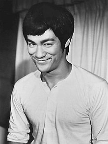 A smiling Bruce Lee