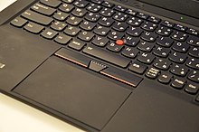 Photograph of the ThinkPad X1 Carbon's Japanese keyboard, track point, and trackpad