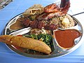 Image 17Traditional Tanzanian food consisting of pilau kuku (seasoned rice with chicken), mishkaki (grilled meat), ndizi (plantain), maharage (beans), mboga (vegetables), chapati (flatbread) and pili pili (hot sauce) (from Culture of Tanzania)