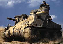 photographie en couleur montrant un char roulant dans le sable