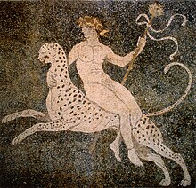 A nude Dionysos, adorned with divine regalia, riding on a cheetah.