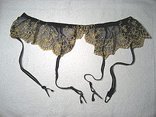 A garter belt showing suspenders attached to the bottom