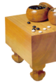 Image 3A traditional Japanese set, with a solid wooden floor board (碁盤 goban), 2 bowls (碁笥 goke) and 361 stones (碁石 goishi) (from Go (game))