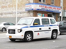 Exterior of an Access-A-Ride cab, with the Access-A-Ride logo