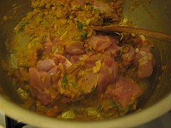 Step 6—Biryani Masala, adding and mixing chicken pieces