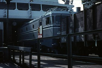 A CFR Class EA locomotive being loaded into the Trelleborg-Sassnitz railway ferry on its way from Västerås, Sweden to Brașov, Romania, 1966
