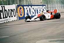 A picture of Ayrton Senna driving a McLaren MP4/6 formula one car during the 1991 United States Grand Prix.