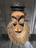 Mulwalwa mask; 19th or early 20th century; painted wood and raffia; Ethnological Museum of Berlin. This mask embodies a powerful nature spirit. As there are no holes through which a performer could see, it was probably mounted on a wall at an initiation camp, signaling that the initiation was almost complete