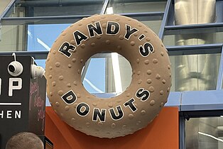 A miniature version of the Randy's Donuts sign at its LAX location.