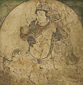 An apsara (feitian) playing pipa, using fingers with the pipa held in near upright position. Mural from Kizil, estimated Five Dynasties to Yuan dynasty, 10th to 13th century.[76]
