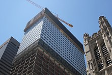 Demolition of the facade underway in 2021, with the lower section of the facade already having been stripped
