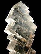 Crystals: cube-shaped crystals of halite (rock salt); cubic crystal system, isometric hexoctahedral crystal symmetry